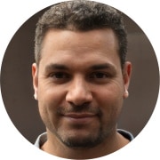 A circular portrait photograph of Jesse G.