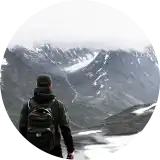 A circular portrait photograph of team member Tim.